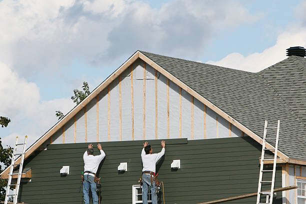 Professional Storm Damage Siding Repair technician working in Cambridge, MA